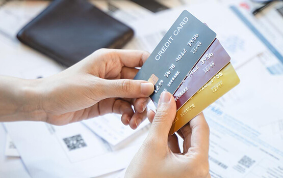 Bills and statements being sorted at a desk